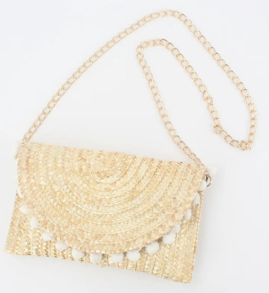 Sac bandoulière en paille – Chaîne dorée & pompons blancs